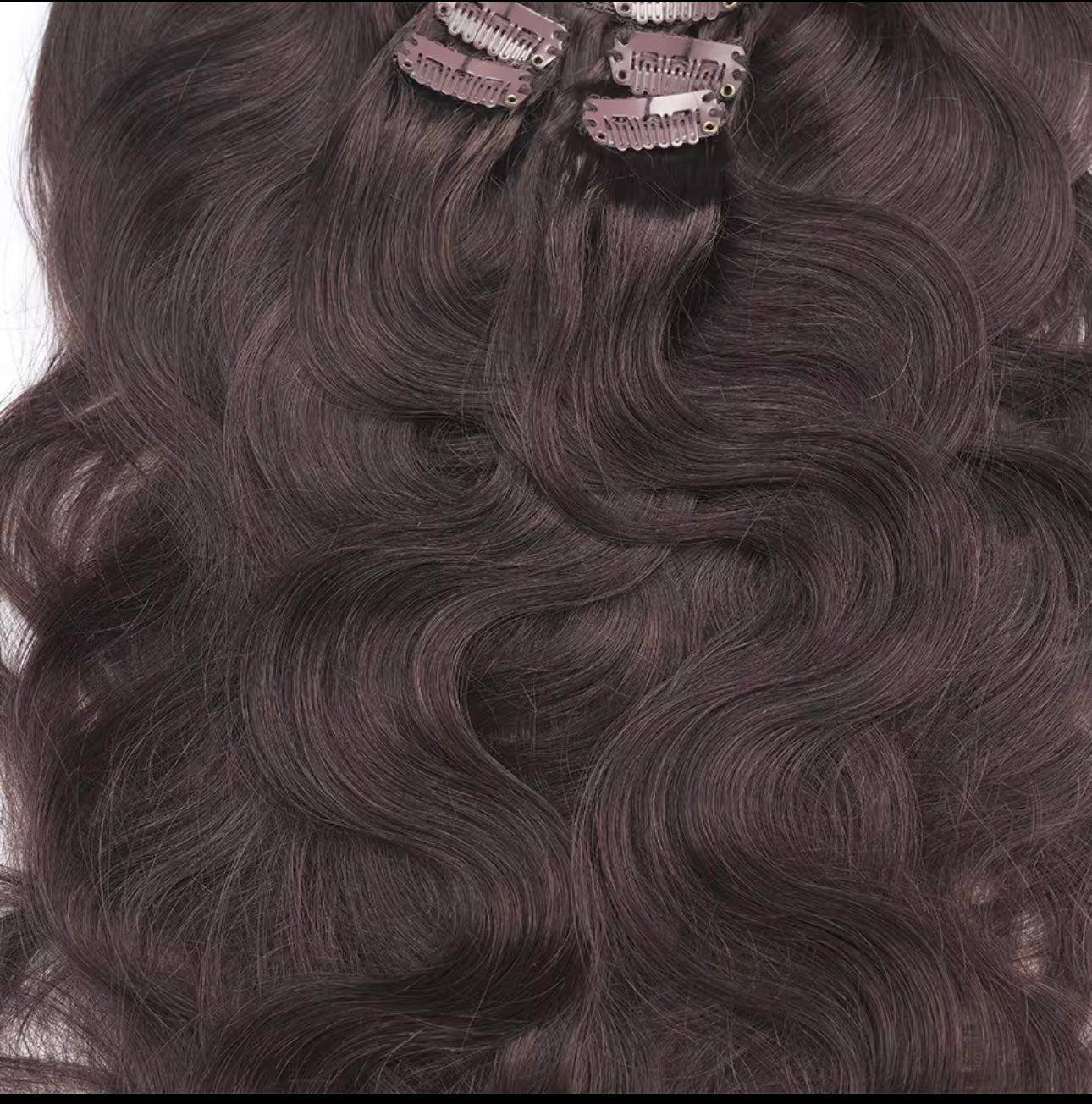 Raqlyn Brown hair extensions with clips on a white background